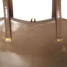 Load image into Gallery viewer, Vintage 50s/60s Handbag In Taupe/ Mushroom Glossy Patent Leather w/ Gilt Bow Detail And A Dainty Gilt Clasp By Widegate-Vintage Handbag, Kelly Bag-Brand Spanking Vintage